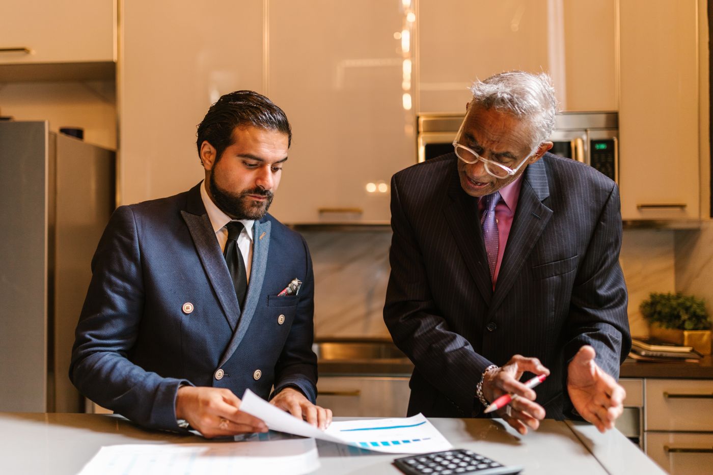 An adviser working through a written plan with a senior client